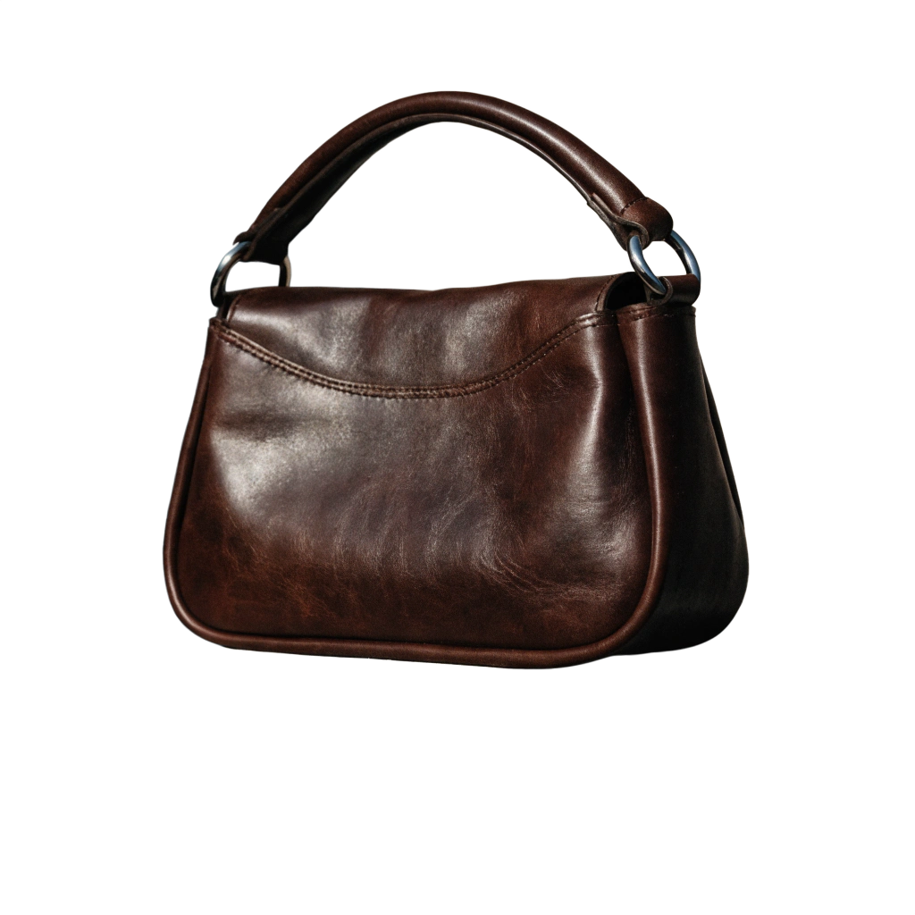 Elegant dark brown leather handbag with a curved silhouette and top handle on a black background.